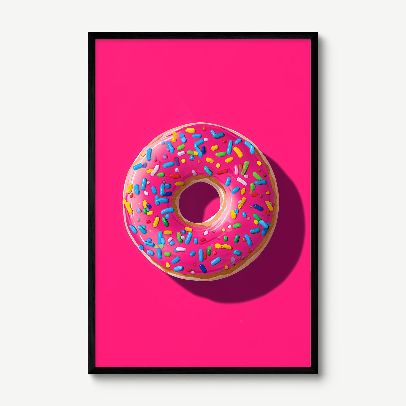 Pink Donut art print in a black frame
